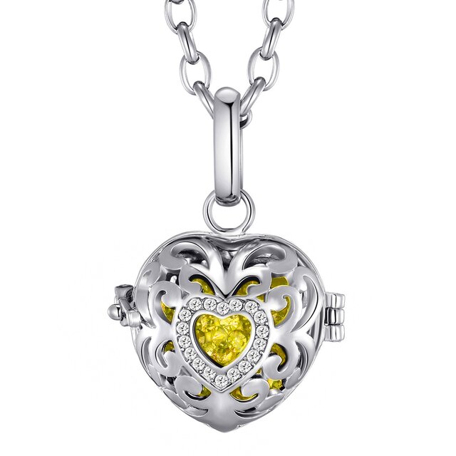 Morella Damen Schutzengel Halskette Edelstahl 70 cm mit Anhänger Herz Liebe und Klangkugel gelb Ø 16 mm in Schmuckbeutel